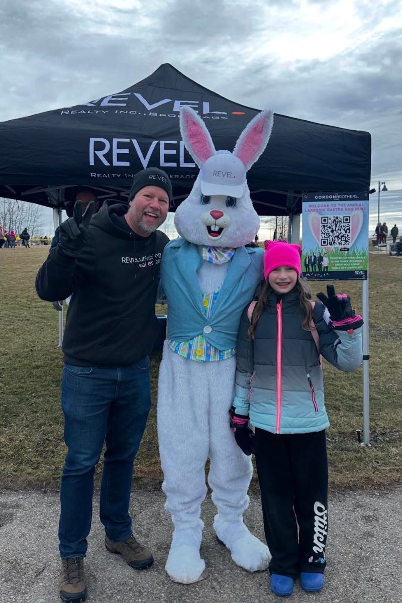 Doug Gordon with the Easter Bunny and a young resident at the annual Lakeside Easter Egg Hunt in Ajax