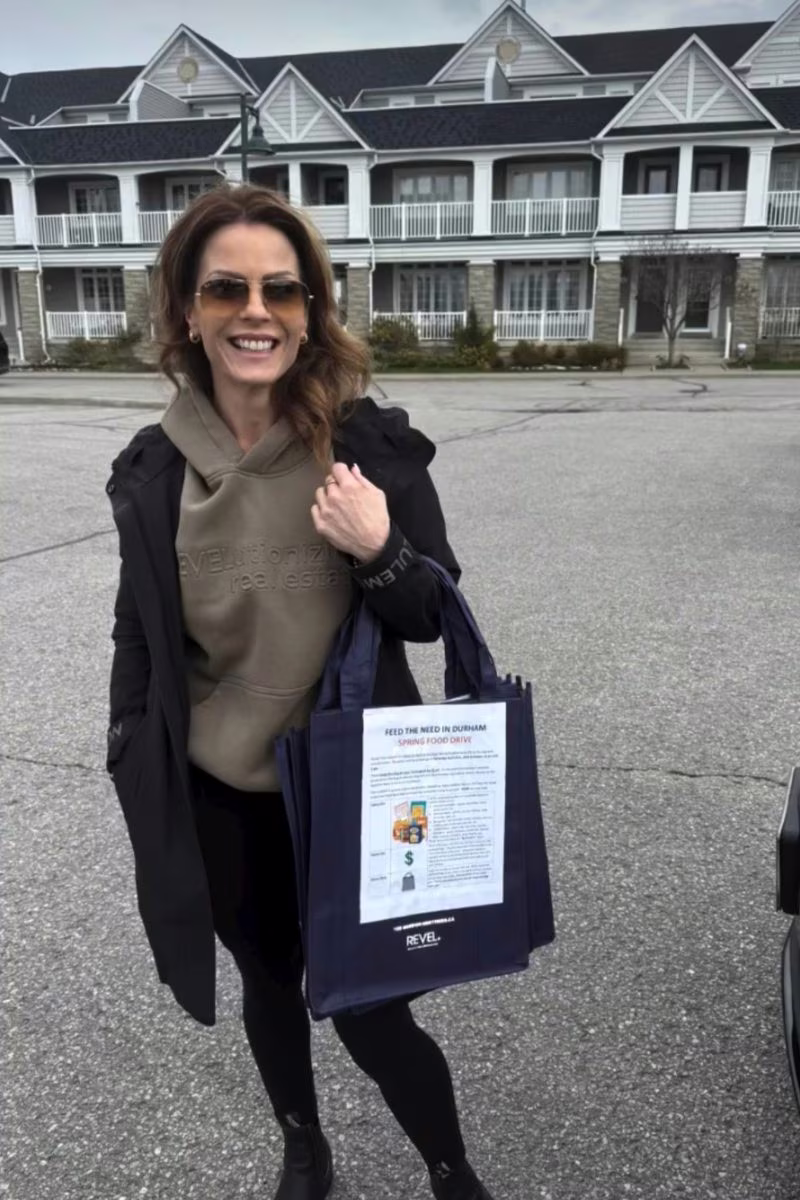 Mel Da Silva collecting Feed the Need Durham food-drive donations outside Lakeside townhomes in Ajax