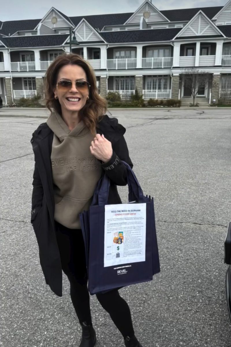 Mel Da Silva collecting Feed the Need Durham food-drive donations outside Lakeside townhomes in Ajax