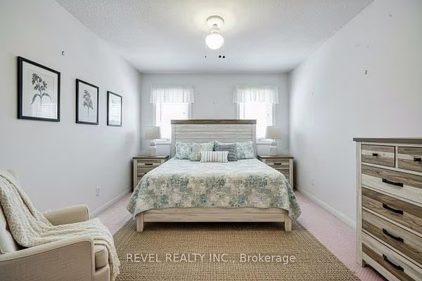 Third-floor second bedroom with a double closet at 1400 The Esplanade N #411, Pickering, listed by The Gordon Brothers Team, Revel Realty Inc., Brokerage