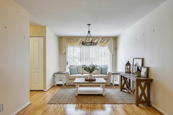 Open-concept living room with hardwood flooring at 1400 The Esplanade N #411, Pickering, listed by The Gordon Brothers Team, Revel Realty Inc., Brokerage