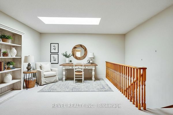Third-floor loft with a skylight and built-in shelving at 1400 The Esplanade N #411, Pickering, listed by The Gordon Brothers Team, Revel Realty Inc., Brokerage