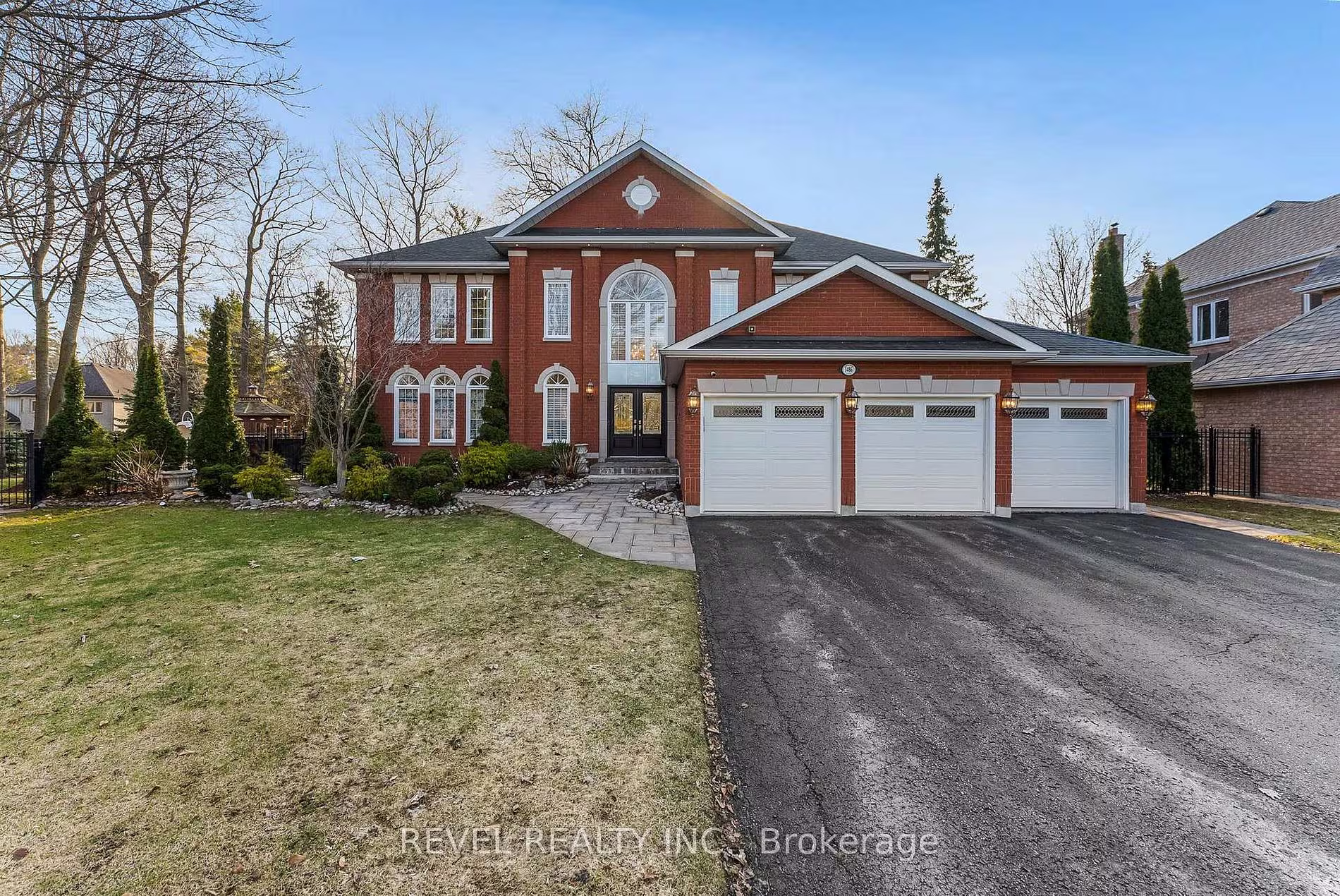 1486 Ashwood Gate, Pickering, a red-brick executive home with a three-car garage in the Tall Trees Enclave of Rougemount, for sale with The Gordon Brothers Team