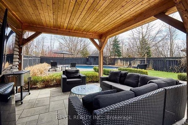 Covered timber-frame pavilion with a lounge area at 475 Poplar Avenue, Ajax