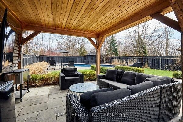 Covered timber-frame pavilion with a lounge area at 475 Poplar Avenue, Ajax