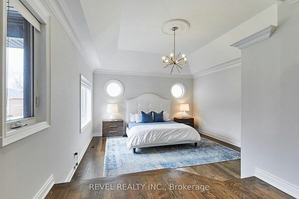 Primary bedroom with a vaulted ceiling and gas fireplace at 475 Poplar Avenue, Ajax